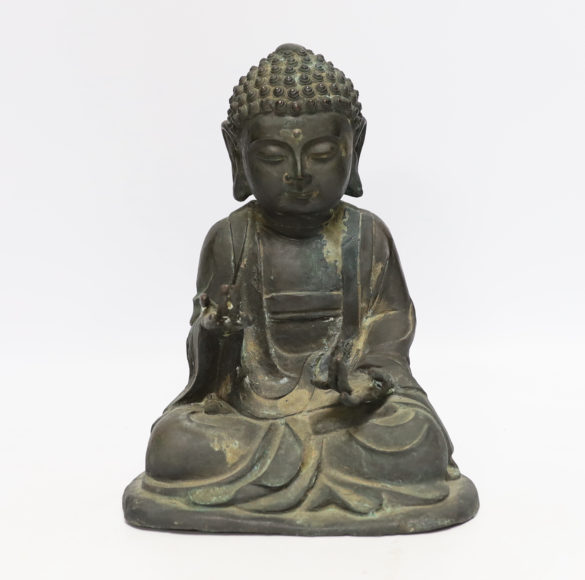 A Chinese bronze figure of Buddha Shakyamuni, Ming style, 25cm high